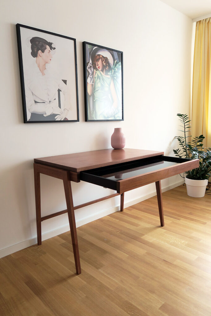Home desk Harold is made of solid mahogany wood with a large drawer. The solid wood makes the desk heavy and stable.