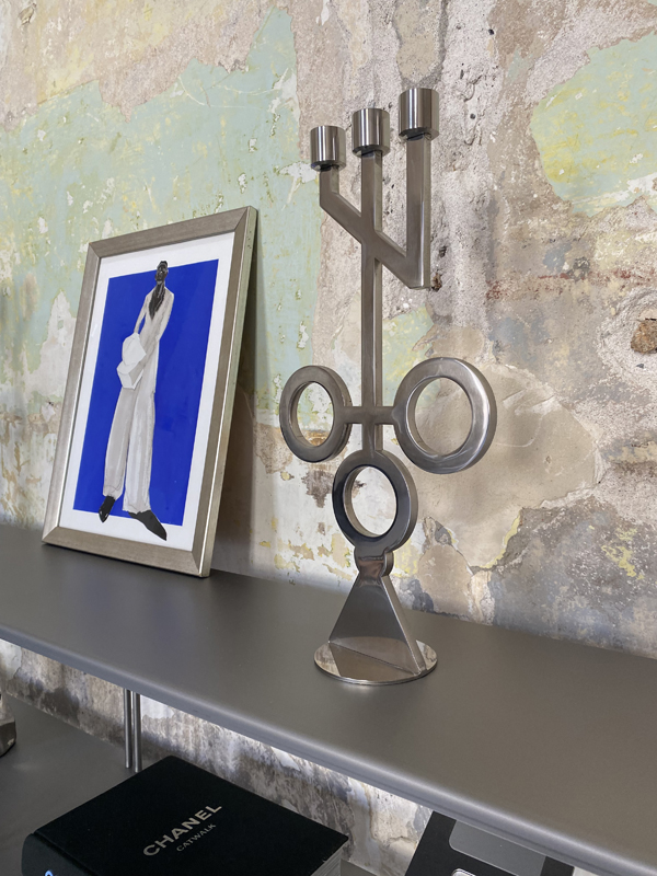 This handmade, polished stainless steel candle holder is a unique decorative element with a distinctive, geometric form. Its sharp lines, decisive proportions, and sculptural character make it a powerful accent in any space—ideal for lovers of modern interiors, loft style, and industrial minimalism.