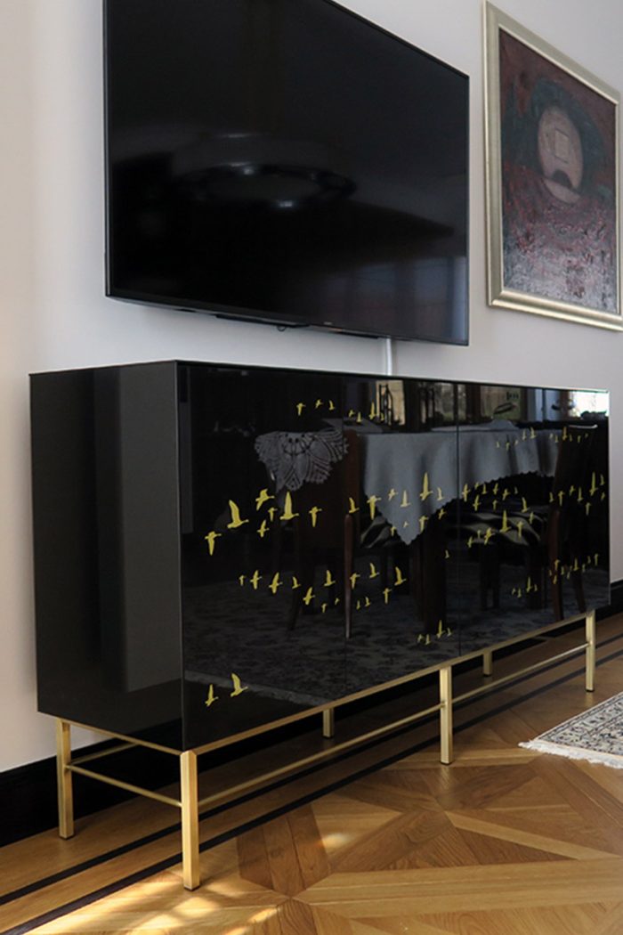 Sideboard Tamara in Art Deco Style Art deco sideboard black glass with imprints and a base made of polished brass